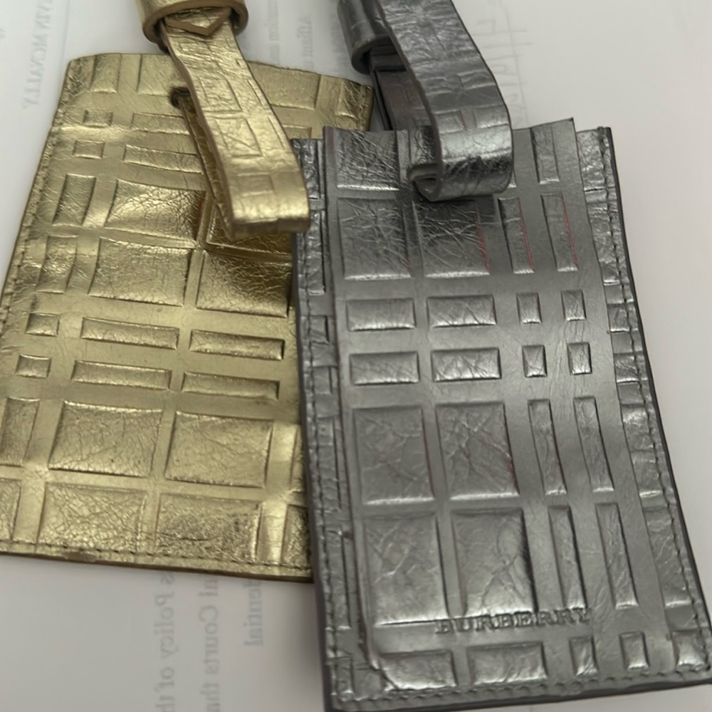 Burberry luggage tags never used. In brand new condition without tags.